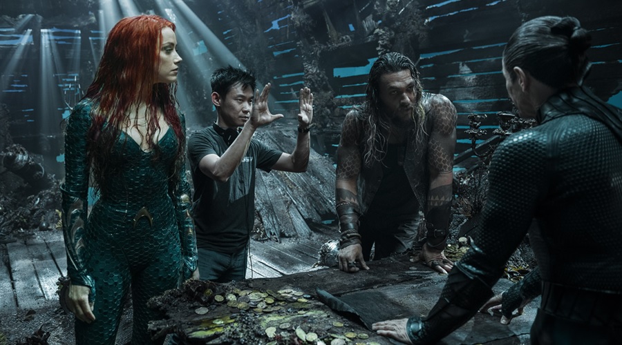 Director James Wan with Jason Momoa, Amber Heard and Willem Dafoe on the set of Aquaman