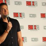 Zachary Levi with a microphone at his Q&A panel at FanExpo Canada in Toronto on August 24, 2019.