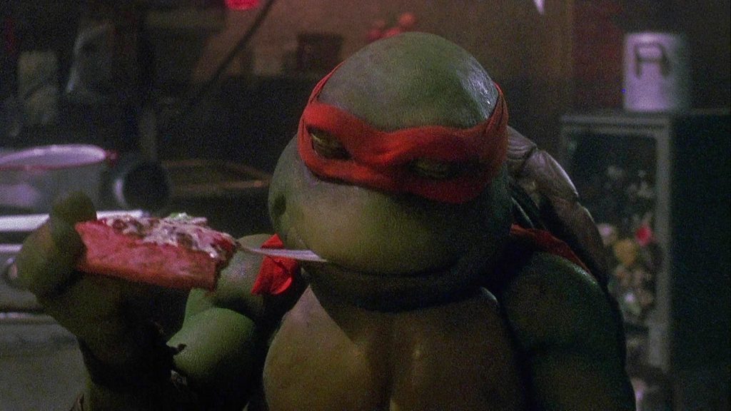 Raphael eating pizza in Teenage Mutant Ninja Turtles (1990)