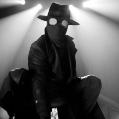 Nicolas Cage as The Spider crouched in Spider-Noir