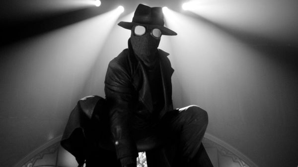Nicolas Cage as The Spider crouched in Spider-Noir